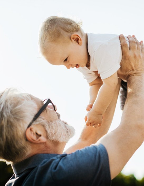 grandfather holding child